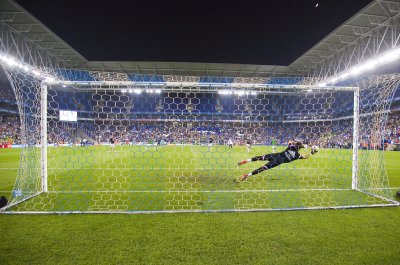 Fotobehang Keeper vangt de bal