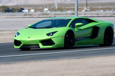 Fotobehang LAMBORGHINI AVENTADOR LP700 driving on race track