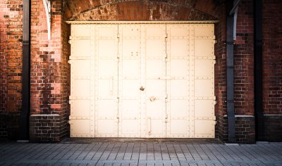 Fotobehang Steel Door in a red brick wall background