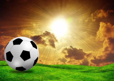 Fotobehang Voetbal in de zonsondergang
